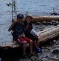 We have a 28' 2014 Springdale travel trailer, and one of our favourite places to visit is Kootenay Lake. My older son loves to fish while his younger brother loves to lend his moral support. Here they are taking a break from fishing long enough to pose for a photo.