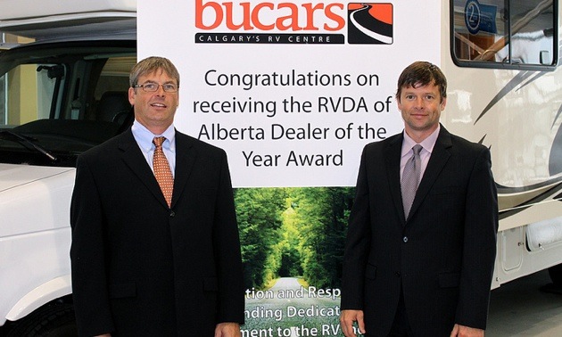 Kyle and Jeff Redmond in the Bucars showroom.