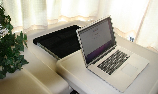 Photo of a laptop on a countertop of an RV.