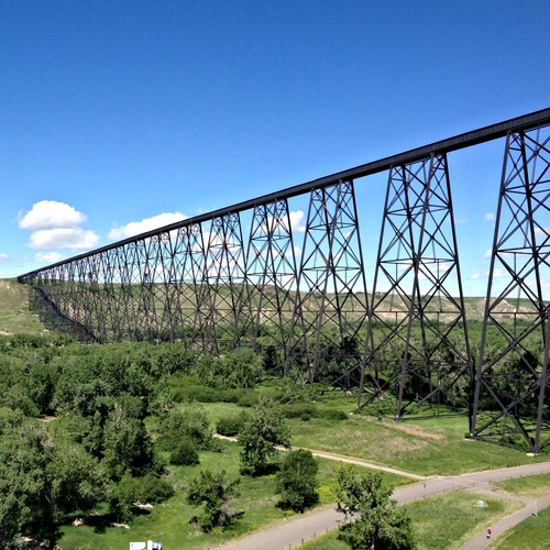 Bridge with the trees below and a sunny sky