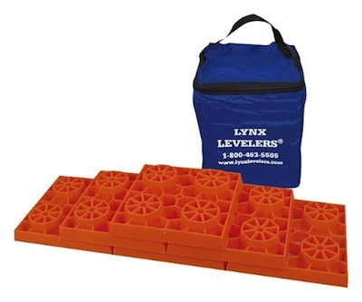 Orange plastic RV levelers with carrying bag