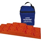 Orange plastic RV levelers with carrying bag