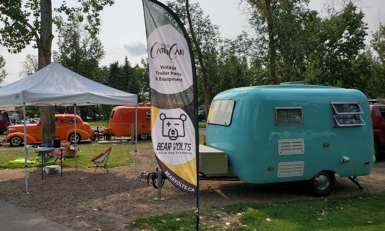 vintage RV with awning and lights