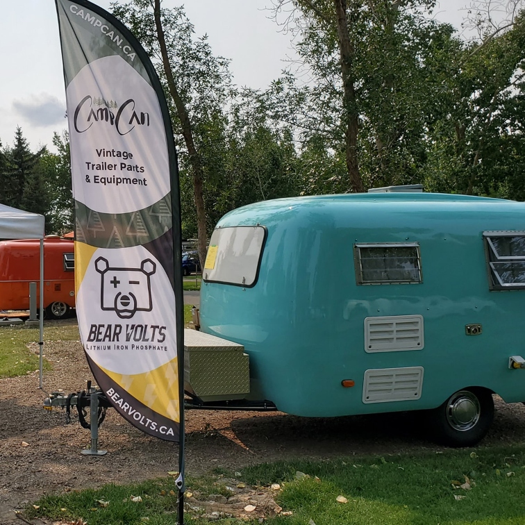 vintage RV with awning and lights