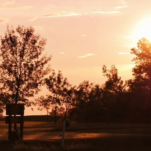 Shown is a sunset over the Manitou Beach Golf Club in Manitou Beach, Saskatchewan.