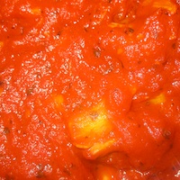 The marinara sauce in final stages of cooking. 