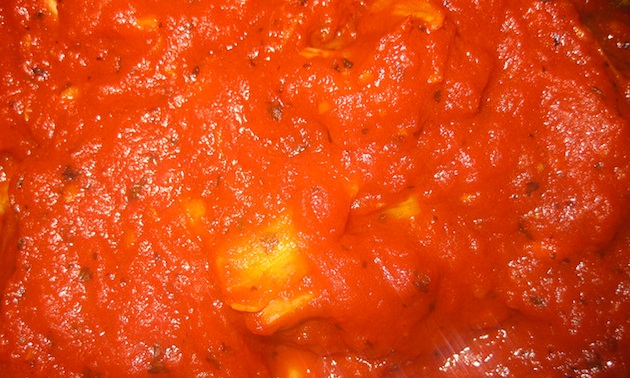 The marinara sauce in final stages of cooking. 