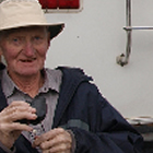 man sitting behind an RV