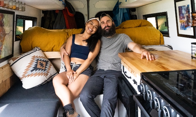 Meghan and Matt sitting in their van together