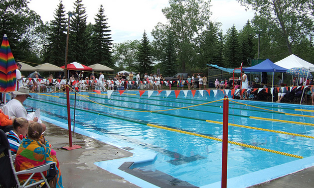 people around a swimming pool