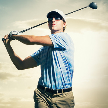 A man finishing his golf swing 