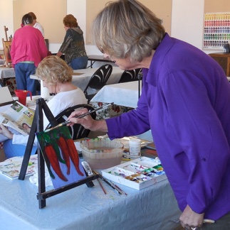 Jan Doherty finishes her acrylic painting at the Mesquite fine arts classroom. 