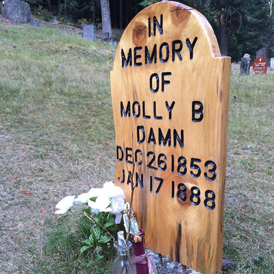 The Molly B Damn grave has a new simple wooden grave marker.