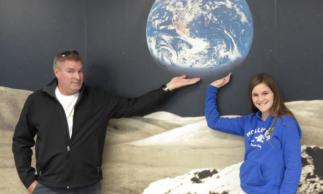 Haley and Glyn hold the whole world in their hands at Pima Air and Space Museum.