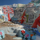 Colourful man-made mountain of clay painted with primitive religious symbols