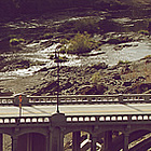 river flowing underneath a bridge