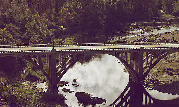 river flowing underneath a bridge