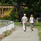 people walking on the waterfront boardwalk