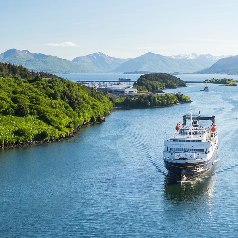 ferry passing by coastal Alaska communities