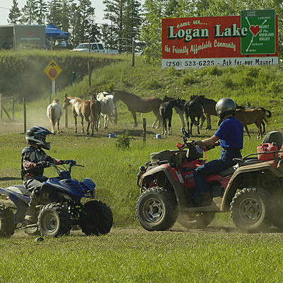 Two people on ATV's. 