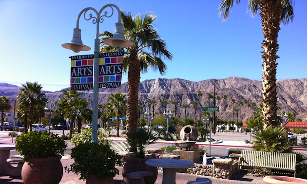 Palm trees, mountains and banners