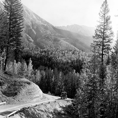 A section of the Banff-Windermere Highway near Vermilion River in 1926 is narrow and windy. The road officially opened to traffic in 1923, but its construction is a story in and of itself.