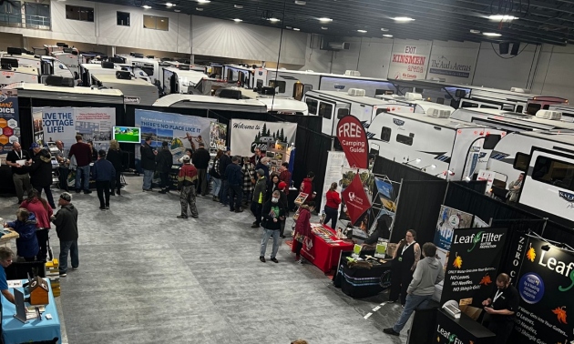 RVs lined up with people looking at them at the last expo