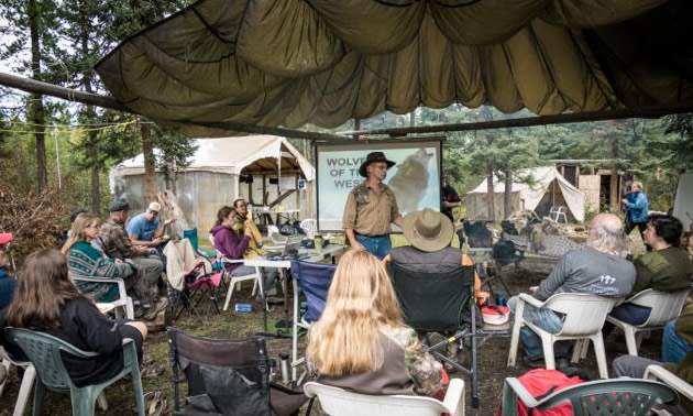 Ross Hinter is giving a presentation about the wolves of Western Canada at Rat Root Rendezvous, an annual primitive skills gathering held by Karamat Wilderness Ways near Wildwood, Alberta, every August.