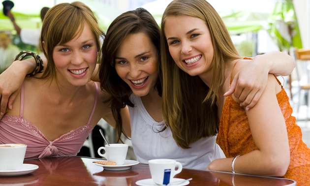 ladies enjoying coffee outside 