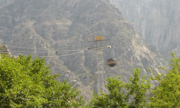 tram passing over a mountain
