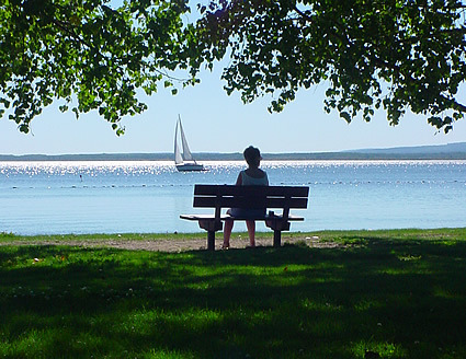Person sitting on a dock