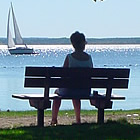 Person sitting on a dock