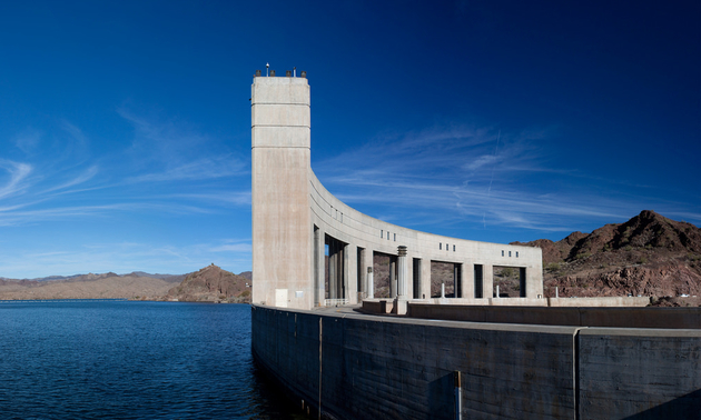 This is a photo of the Parker Dam with blue sky and the blue waters of Lake Havasu.

