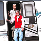 Jim and Shirley Pedersen posing in front of their 1998 26 1/2-foot Corsair 5th Wheel in Yuma, Arizona, while RVing from January to March, 2011.