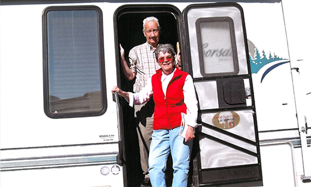 Jim and Shirley Pedersen posing in front of their 1998 26 1/2-foot Corsair 5th Wheel in Yuma, Arizona, while RVing from January to March, 2011.