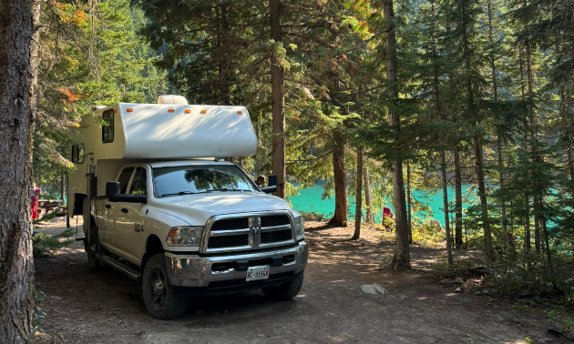 RV driving through a campground in fall