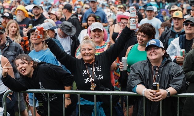 people celebrating in a crowd at the Pigeon Lake festival