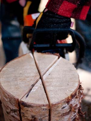 Three crisscross cuts half the length of the log,