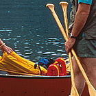 people getting into a boat