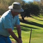 a golfer prepares to take a swing on a golf course 