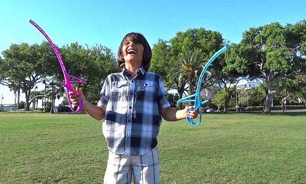 A boy playing RingStix.