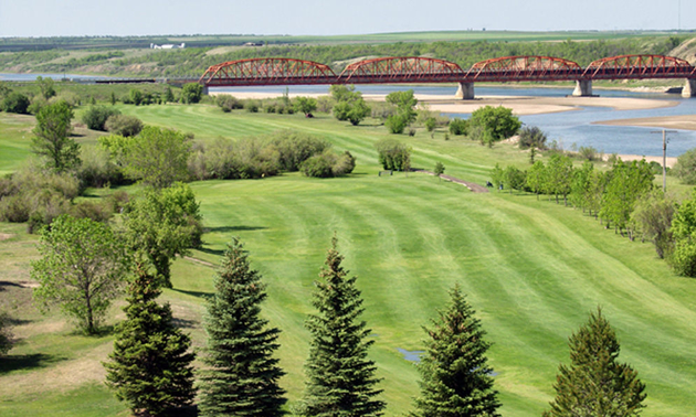 The Riverview Golf Course is shown with Outlook's famous bridge in the background.