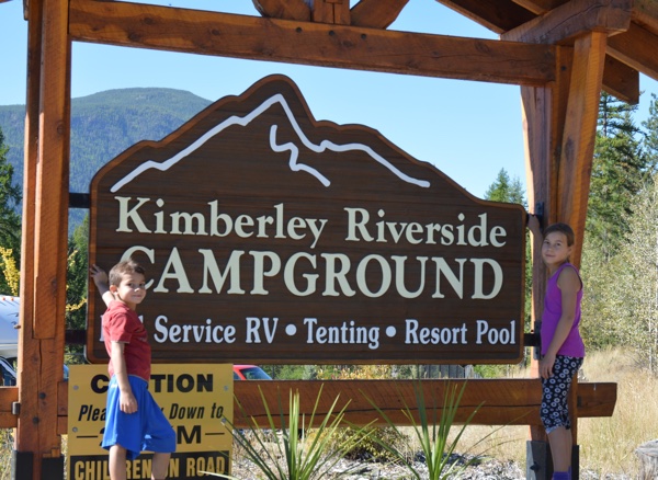 Daphne and Oliver Gonzalez standing next to the Kimberley Riverside Campground sign.