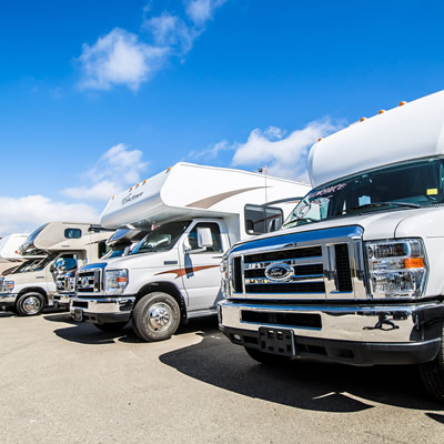 Row of Class C motorhomes. 