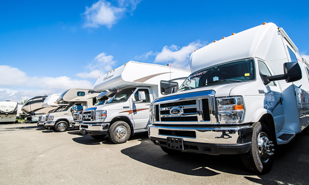 Row of Class C motorhomes. 