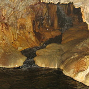 This photo shows Ainsworth's natural cave with healing mineral waters on the bottom.