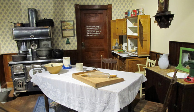 A kitchen with a vintage table and stove set with various utensils is one exhibit at the Western Development Museum in North Battleford.