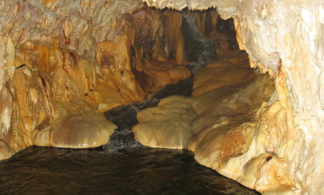 This photo shows Ainsworth's natural cave with healing mineral waters on the bottom.