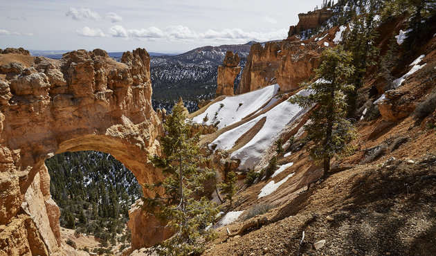 Snow at The Bridge, an arch created by erosion.