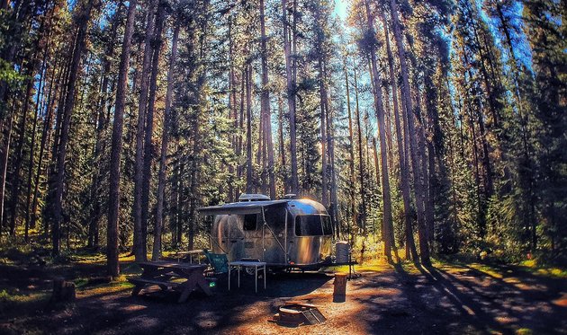 Banff Alberta photo contest entry - RV in a treed in site